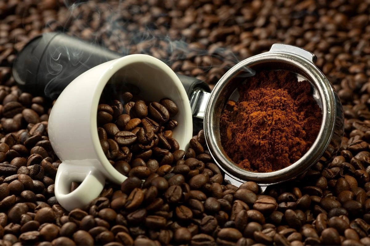 03-coffee-bean-vs-grounded Whole coffee beans next to ground coffee